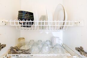 Monochrome Style 2 Bedrooms at Kalibata City Apartment By Travelio