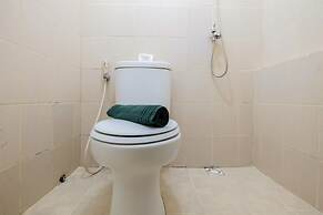 Monochrome Style 2 Bedrooms at Kalibata City Apartment By Travelio