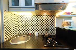 Monochrome Style 2 Bedrooms at Kalibata City Apartment By Travelio