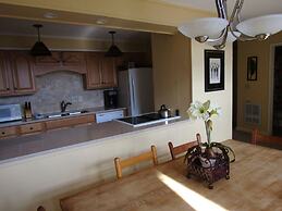 High Ceiling Skyleaf A9 Condo with Fireplace by RedAwning