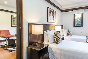 Travelers Suites Condominio Plenitud