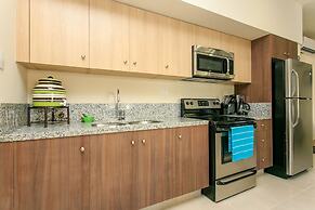 Condo Complex with an Alluring Pool & Tropical Vibes by Stella Rentals