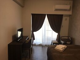 Mr.KINJO inn in front of Children Medical Care Center