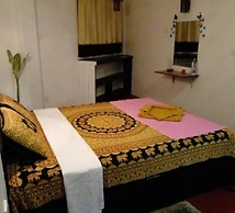 Malika's Yellow House