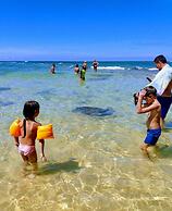 Malika's Yellow House