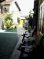 Malika's Yellow House