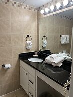 Newly Renovated 102 2BD Condo with Riverview Balcony by RedAwning