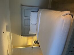 Newly Renovated 102 2BD Condo with Riverview Balcony by RedAwning