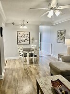 Newly Renovated 102 2BD Condo with Riverview Balcony by RedAwning