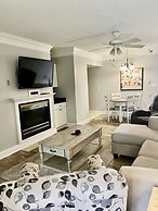 Newly Renovated 102 2BD Condo with Riverview Balcony by RedAwning