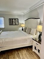 Newly Renovated 102 2BD Condo with Riverview Balcony by RedAwning