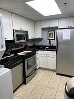 Newly Renovated 102 2BD Condo with Riverview Balcony by RedAwning