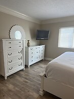 Newly Renovated 102 2BD Condo with Riverview Balcony by RedAwning