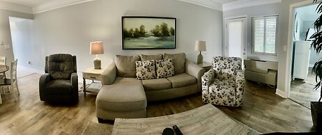 Newly Renovated 102 2BD Condo with Riverview Balcony by RedAwning