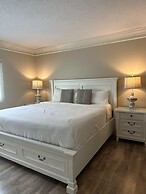 Newly Renovated 102 2BD Condo with Riverview Balcony by RedAwning