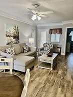 Newly Renovated 102 2BD Condo with Riverview Balcony by RedAwning