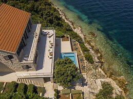 Beachfront Villa Poseidon with Heated Pool