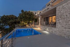Beachfront Villa Poseidon with Heated Pool