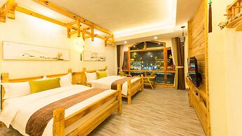 Floral Hotel Fenghuang Huercaowu