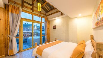 Floral Hotel Fenghuang Huercaowu