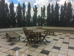 Comfortable Premiere 1BR at The Oasis Apartment