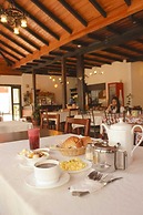 Hotel La Chimenea Casa De Piedad
