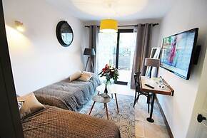 Appartements Pied à Terre, haut standing avec cuisine équipée et terra
