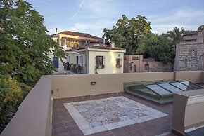 Tripodon Plaka in the shade of Acropolis by GHH