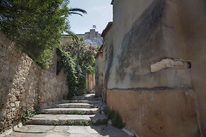 Tripodon Plaka in the shade of Acropolis by GHH