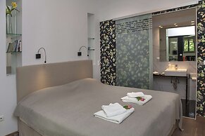 Tripodon Plaka in the shade of Acropolis by GHH