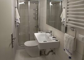 Tripodon Plaka in the shade of Acropolis by GHH