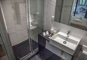 Tripodon Plaka in the shade of Acropolis by GHH