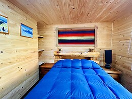 Cabañas entre montañas con tinajas calientes