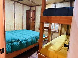 Cabañas entre montañas con tinajas calientes