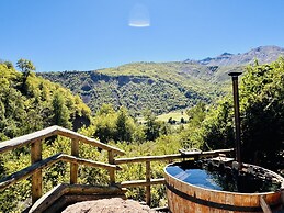 Cabañas entre montañas con tinajas calientes