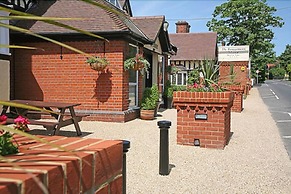 De Rougemont Manor Hotel & Suites