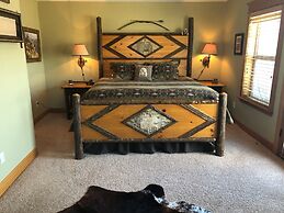 Wanderlust Elegant Townhome includes Rustic Stone Fireplace by RedAwni