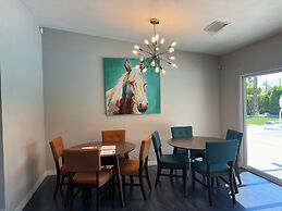 Poolside Living 4 Bedroom Home by RedAwning