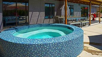 Poolside Living 4 Bedroom Home by RedAwning