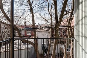 Discover Little Italy From a Bright Apartment