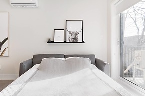 Discover Little Italy From a Bright Apartment