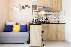 Modern and Bright 2BR Green Pramuka Apartment