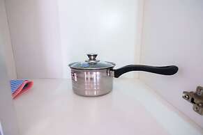 Homey 1BR with Spacious Living Room and Sofa Bed Green Pramuka Apartme