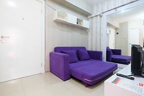 Homey 1BR with Spacious Living Room and Sofa Bed Green Pramuka Apartme