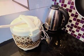 Homey 1BR with Spacious Living Room and Sofa Bed Green Pramuka Apartme