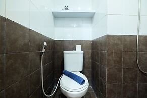 Homey 1BR with Spacious Living Room and Sofa Bed Green Pramuka Apartme