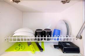 Homey 1BR with Spacious Living Room and Sofa Bed Green Pramuka Apartme