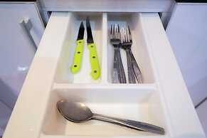 Homey 1BR with Spacious Living Room and Sofa Bed Green Pramuka Apartme