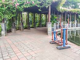 Homey 1BR with Spacious Living Room and Sofa Bed Green Pramuka Apartme