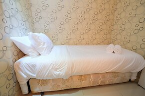 Homey and Relaxing 2BR Green Pramuka Apartment